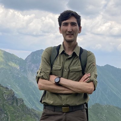 Portrait of Mahmood Soofi in the mountains